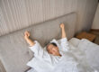 Woman waking from a well rested night's sleep