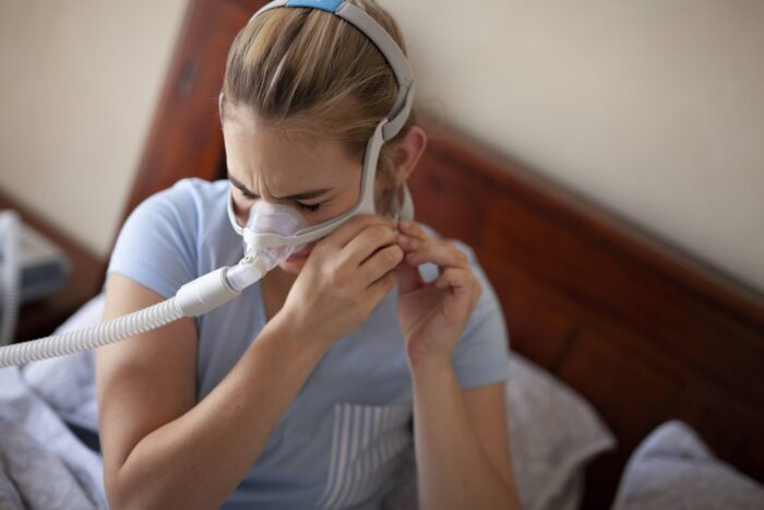 Cpap for Sleep Apnea on Woman in Bedroom